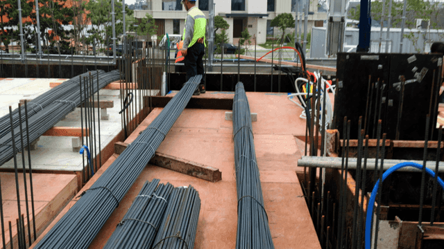 Construction site with rebar and tools