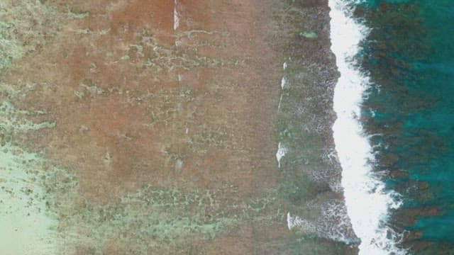 Waves crashing on a sandy beach