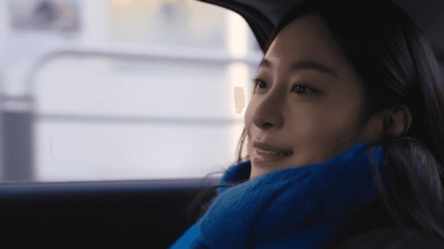 Woman enjoying a car ride