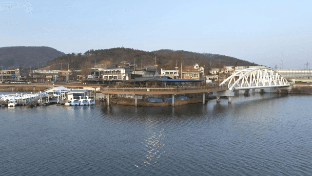 Lake scenery with bridge and paddle boats