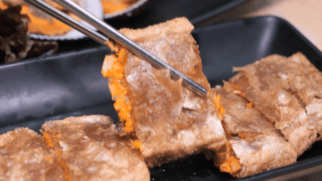 Buckwheat pancake picked up with chopsticks