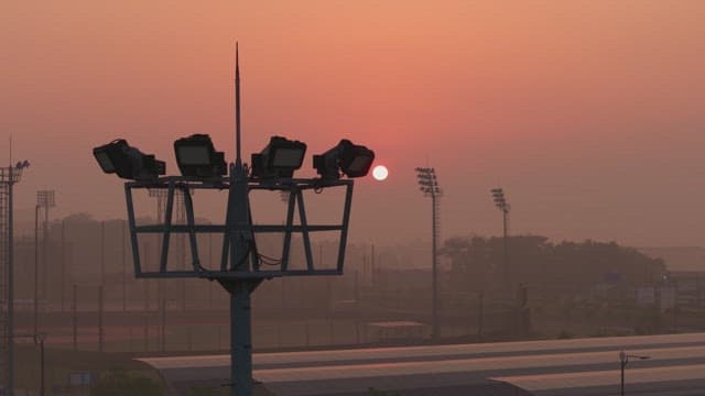 Baseball field at sunset with mist