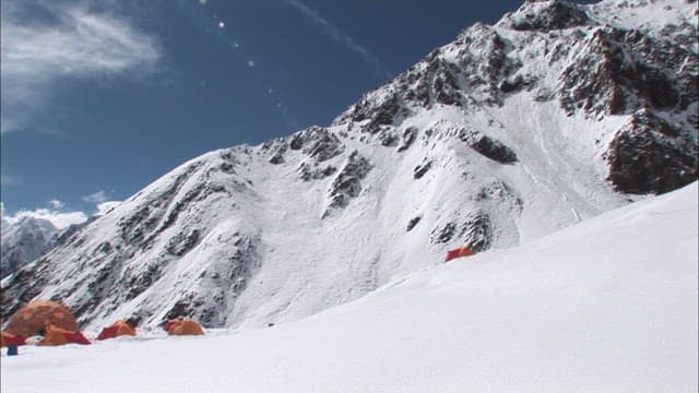 Snow-covered campsite in Spantik Gold Peak