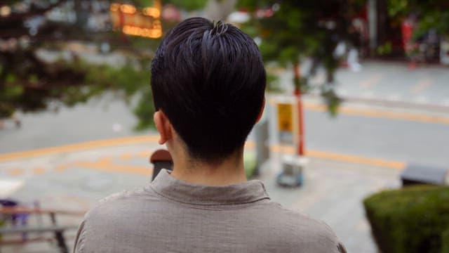 Man standing on stairs looking back