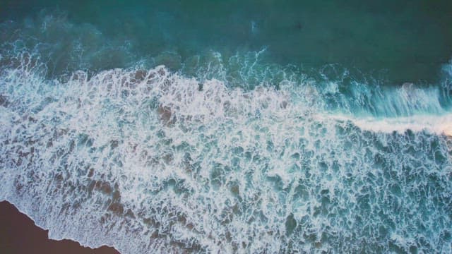 Waves crashing on a sandy beach