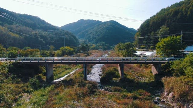 Scenic View of Car Crossing a Bridge