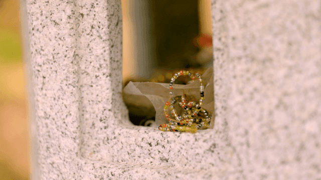 Colorful bead bracelets inside stone structures