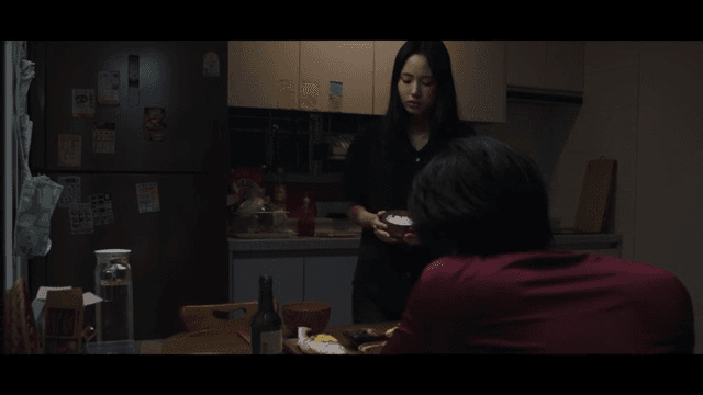 Family dinner in a dark kitchen