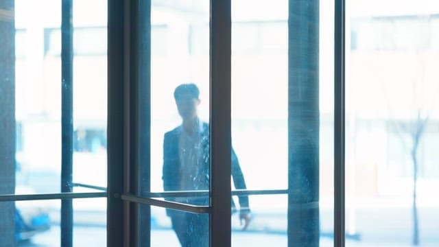 Man entering through a revolving door