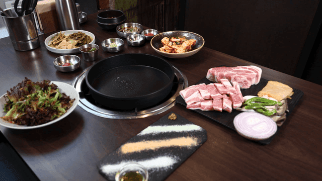 Pork belly grill prepared with side dishes