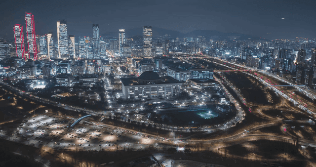 Vibrant night cityscape with high-rise buildings