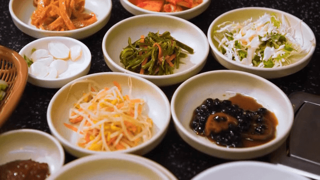 Various Korean side dishes on a table