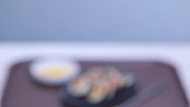 Kimbap and pickled radish on a tray