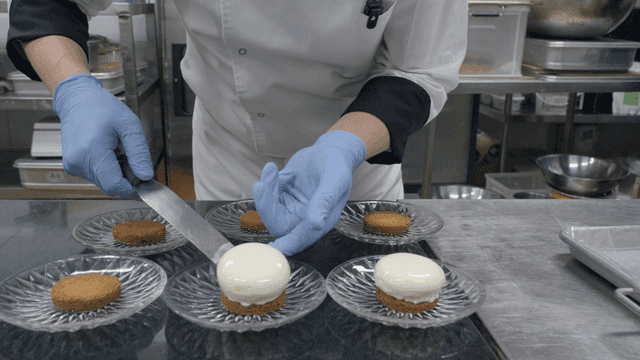 Chef preparing desserts in a kitchen