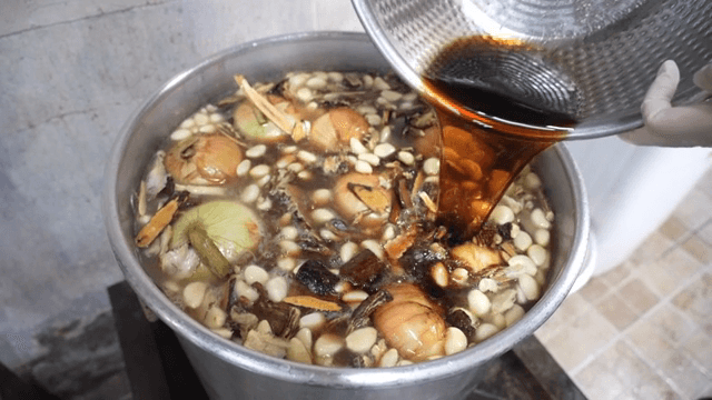 Herbal ingredients boiling in a pot