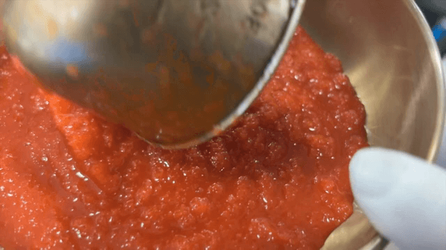 Broth being poured into a bowl of Cold Raw Fish Soup