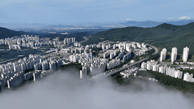 Cityscape with buildings and mountains