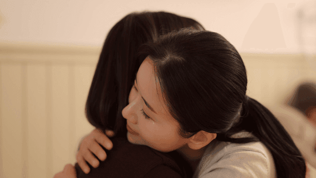 Mother and daughter hugging warmly