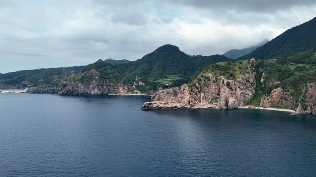 A scenic coastal landscape with cliffs