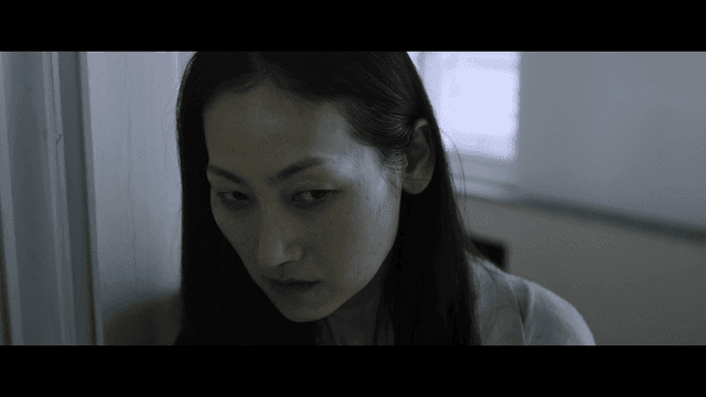 Woman angry in front of classroom door