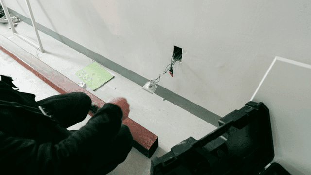 Worker inspecting electrical wiring