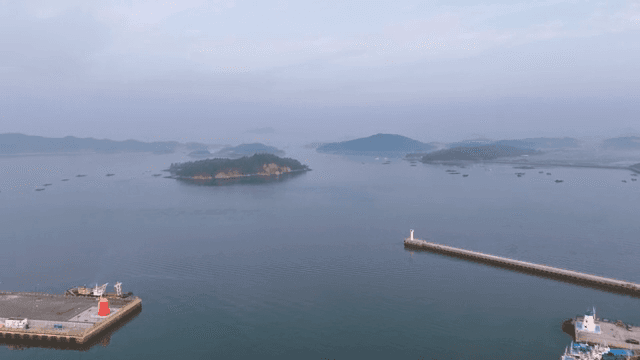 Calm sea with distant islands