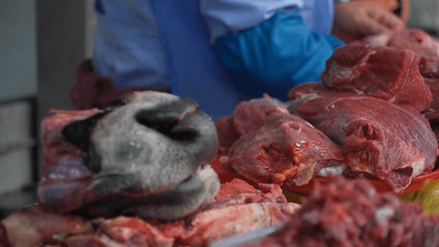 Fresh meat displayed on a market counter