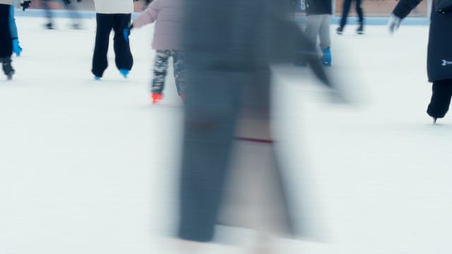 People ice skating at a rink