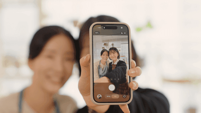Mother and daughter taking selfie