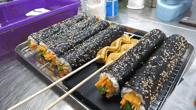 Freshly made kimbap and fish cake skewers
