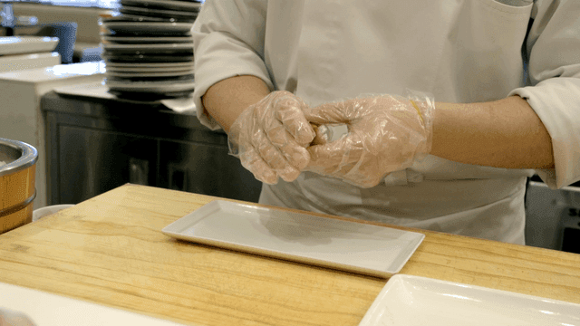 Chef preparing sushi with precision