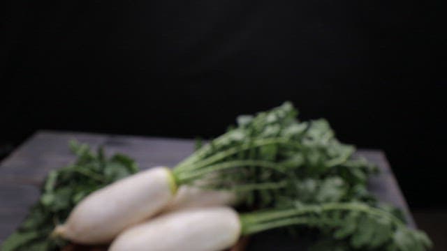 Fresh radishes on a wooden table