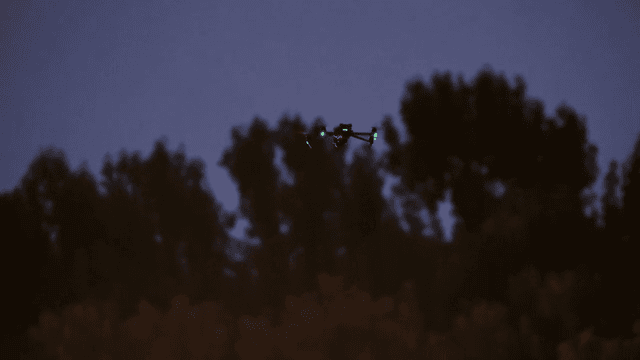 Drone flying in the evening sky