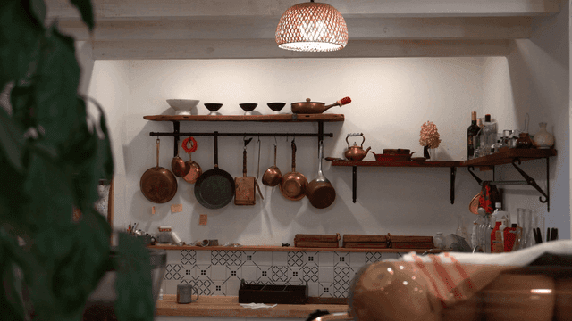 Cozy kitchen with hanging copper pots
