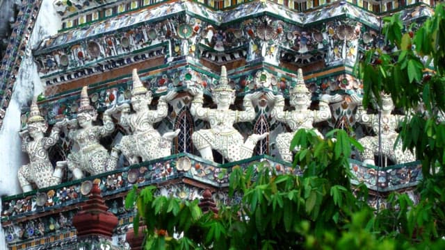 Elaborate sculptures decorate the exterior walls of Thai temples