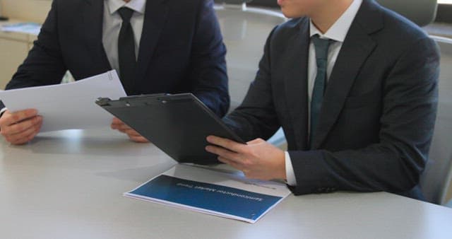 Businessmen reviewing documents in an office