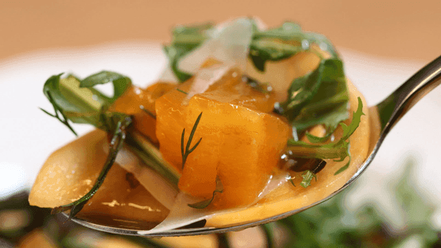 Spoon filled with fresh salad