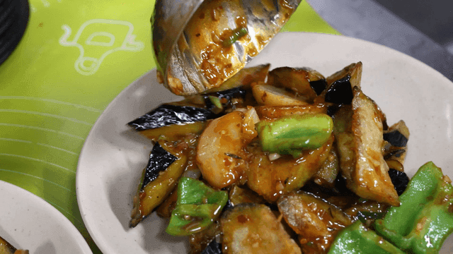 Fried eggplant and stir-fried bell peppers on plate
