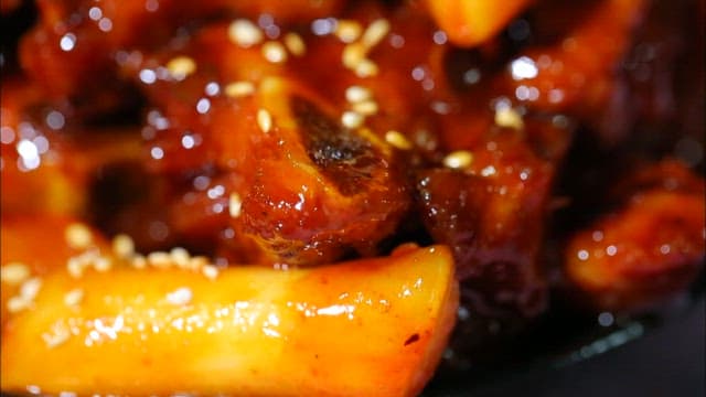 Braised pork ribs topped with sesame seeds