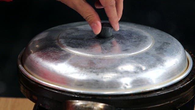 Spicy seasoned braised octopus cooking in a pot