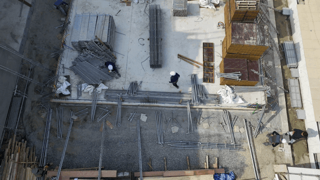 Construction site with workers and materials