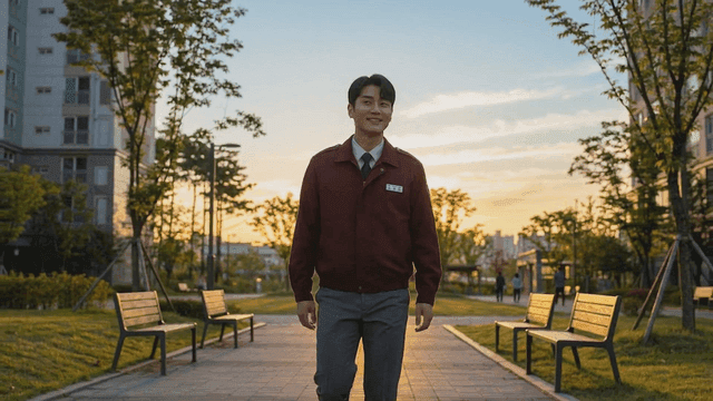 Security guard walking through apartment park at sunset
