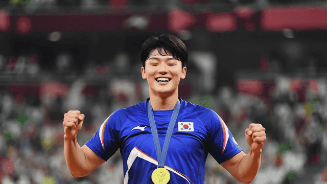 Athlete cheering with gold medal around their neck