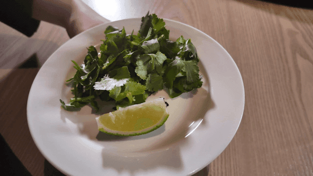Plate with fresh cilantro and lime