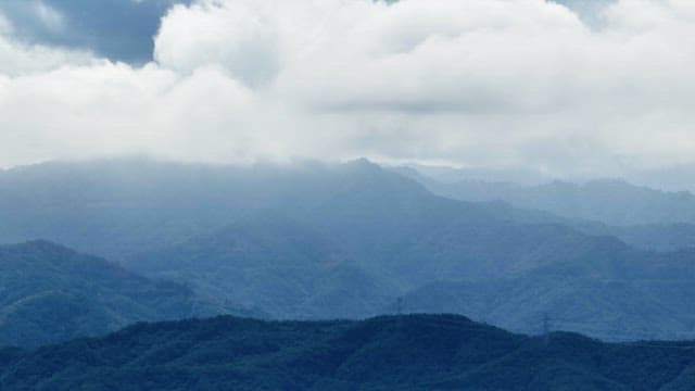 Clouds covering a mountain range