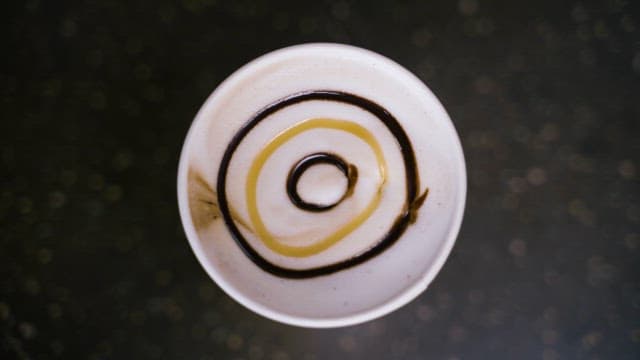 Artistic Design on a Surface of Coffe Cream