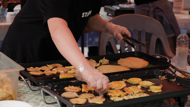 Cooking Jeon on hot iron plate