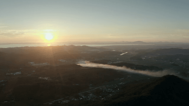 Sunset over a vast mountainous landscape