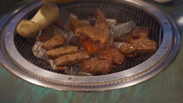 Meat and Vegetables Grilled on a Korean Barbecue Grill