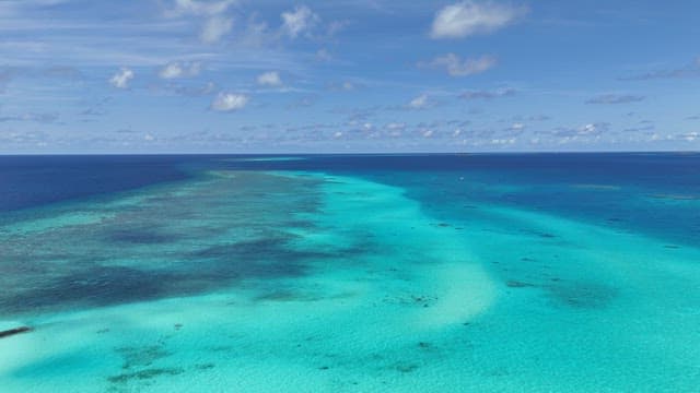 Clear sea with scattered boats